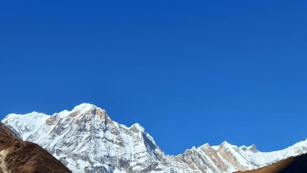 The Annapurna Base Camp (ABC) trek is one of Nepal’s premier, classic trekking routes, taking hikers into the heart of the Annapurna Massif at an altitude of 4,130 meters (13,550 feet). Surrounded by high peaks, including Annapurna I (8,091m), the 10th highest mountain in the world, the camp sits within a natural amphitheater known as the Annapurna Sanctuary.