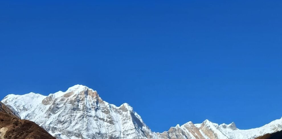 The Annapurna Base Camp (ABC) trek is one of Nepal’s premier, classic trekking routes, taking hikers into the heart of the Annapurna Massif at an altitude of 4,130 meters (13,550 feet). Surrounded by high peaks, including Annapurna I (8,091m), the 10th highest mountain in the world, the camp sits within a natural amphitheater known as the Annapurna Sanctuary.